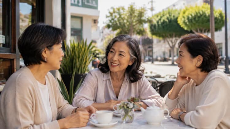 Single Asian women over 50 meeting at a Los Angeles cafe patio